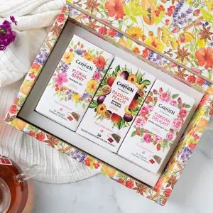 Delightful pyramid tea gift box featuring Floral Berry, Passion Peach, and Turkish Delight flavours, perfect for tea lovers seeking premium herbal infusions.