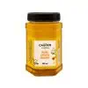 CitrusHoney_packshot Rich, golden jar of Carmién Pure Citrus Honey featuring a black screw cap, highlighting natural lemon and orange blossom flavor, crafted by South African farmers for authentic, healthy honey.