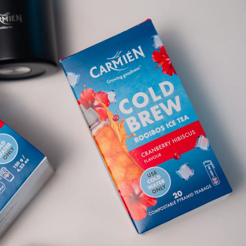 Carmién Cranberry Hibiscus Cold Brew Rooibos Tea box with vibrant packaging and tea bags for refreshing iced tea.
