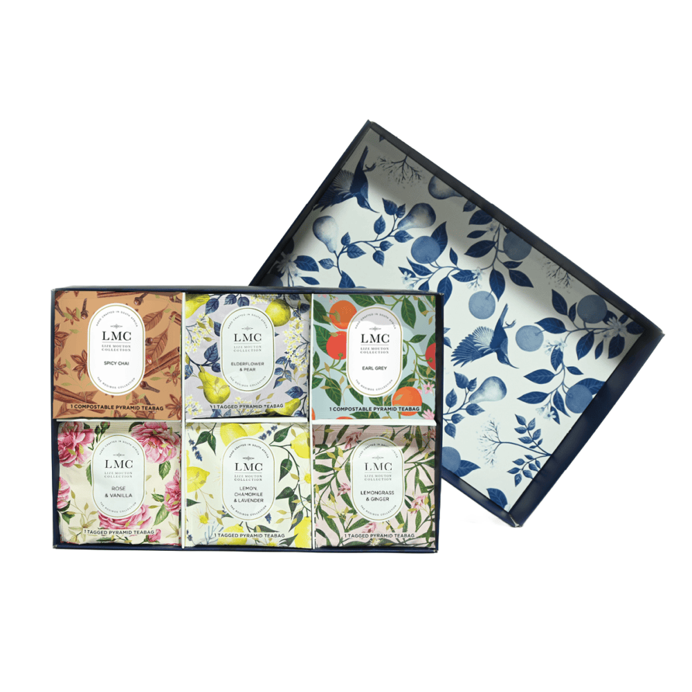 Assorted Carmién Tea gift box featuring six different herbal tea flavours in colourful packaging, perfect for gifting or personal enjoyment.