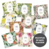 Carmién Rooibos Tea Collection Assorted Carmién Rooibos tea pyramid bags with various flavors including lemon, ginger, and vanilla, showcasing eco-friendly packaging for premium rooibos tea lovers.
