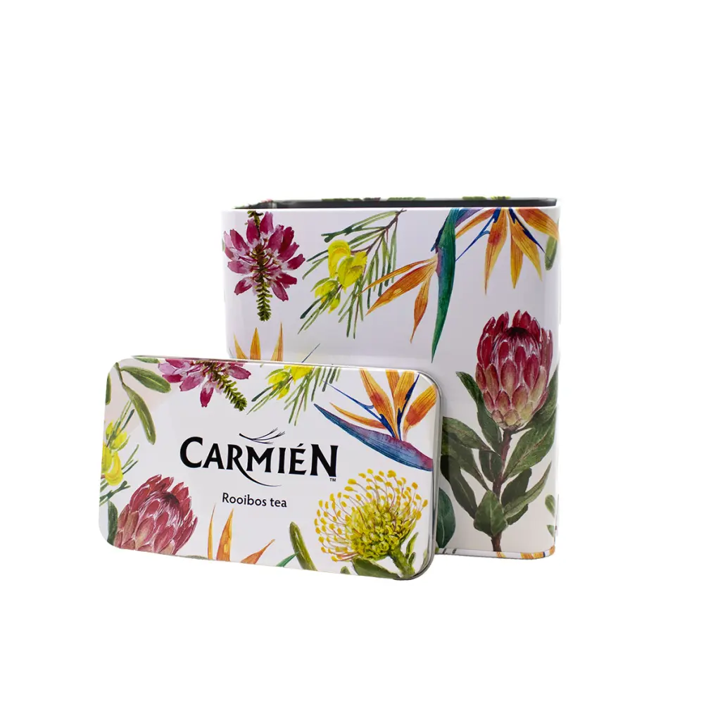 Vibrant floral artwork on Carmién Tea Rooibos tea tin and packaging, highlighting natural ingredients and eco-friendly design, ideal for health-conscious tea enthusiasts.