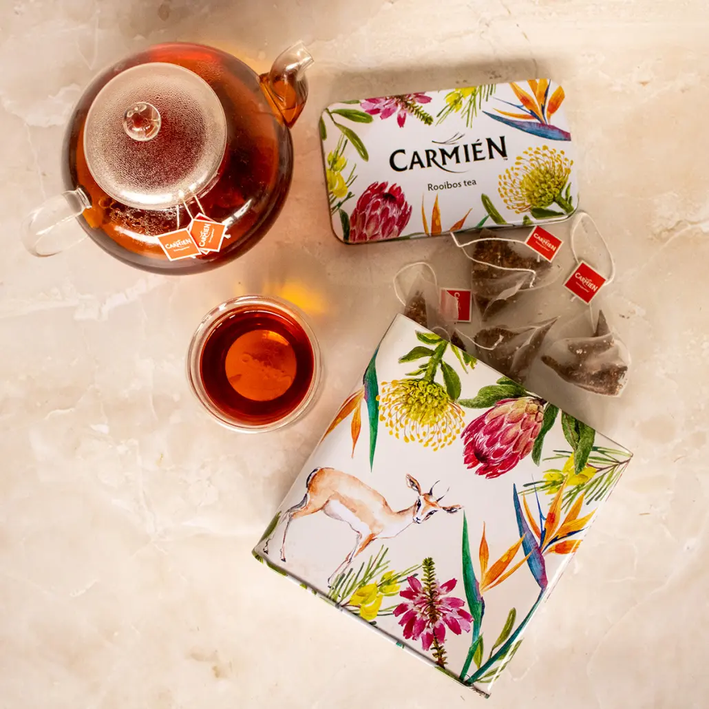 Rich rooibos tea with herbal infusions in decorative packaging, showcasing natural ingredients and vibrant branding, perfect for health-conscious tea lovers seeking authentic South African flavors.