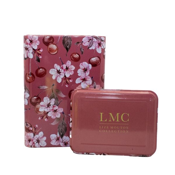 Delicious Carmién Tea packaging with cherry blossom and cherry fruit design, showcasing natural South African herbal tea blends. Perfect for health-conscious tea lovers seeking authentic herbal infusions.
