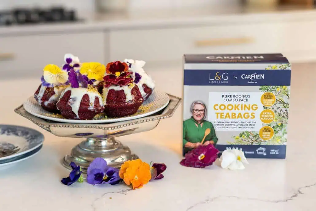 Delicious Rooibos tea desserts with edible flowers, perfect for cooking and baking. Showcasing Carmién Tea's pure Rooibos teabags for flavorful culinary creations.