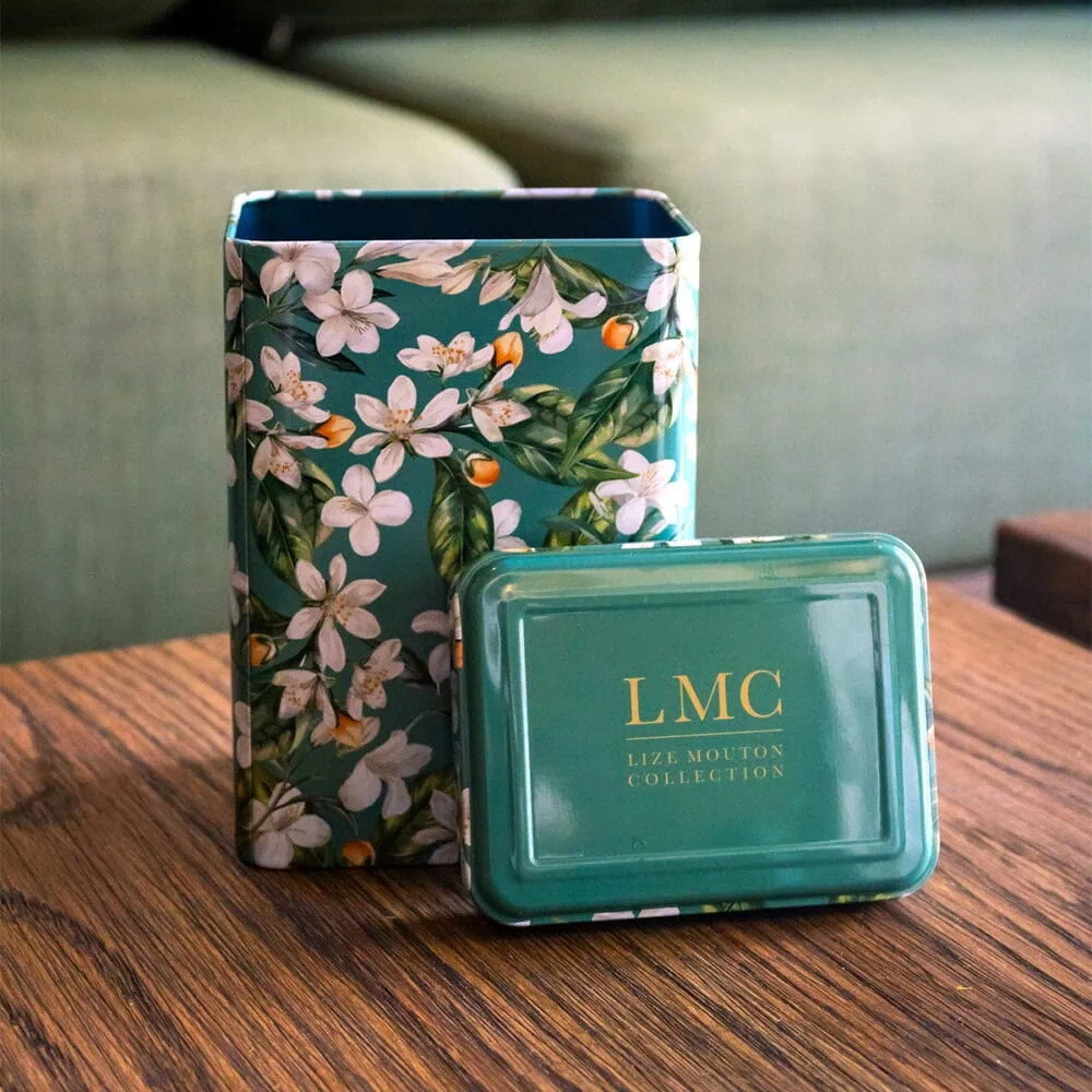 Elegant tea tin featuring jasmine and orange blossom floral design, perfect for storing LMC loose leaf tea. Ideal for tea lovers seeking quality and aesthetic appeal.