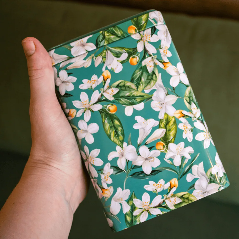 Elegant Jasmine and Orange Blossom Tea Tin for Carmién Tea.