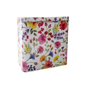Elegant floral berry tea tin with vibrant, colorful flower and berry design. Perfect for storing Carmién Tea and adding a touch of nature to your kitchen.